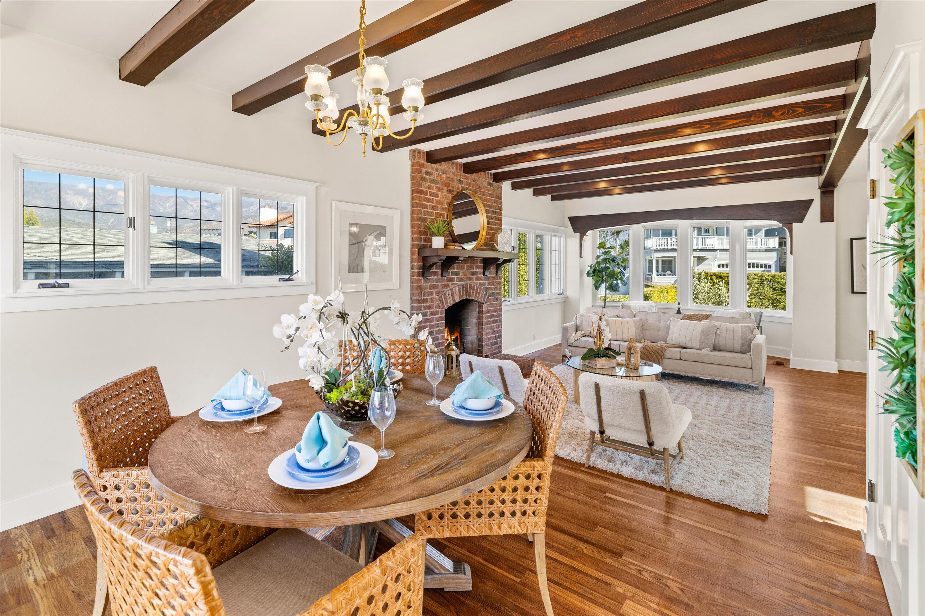 4849 3rd Street Carpinteria, CA 93013 - Photo 14 of 48 a view of a dining room with furniture a chandelier and wooden floor
