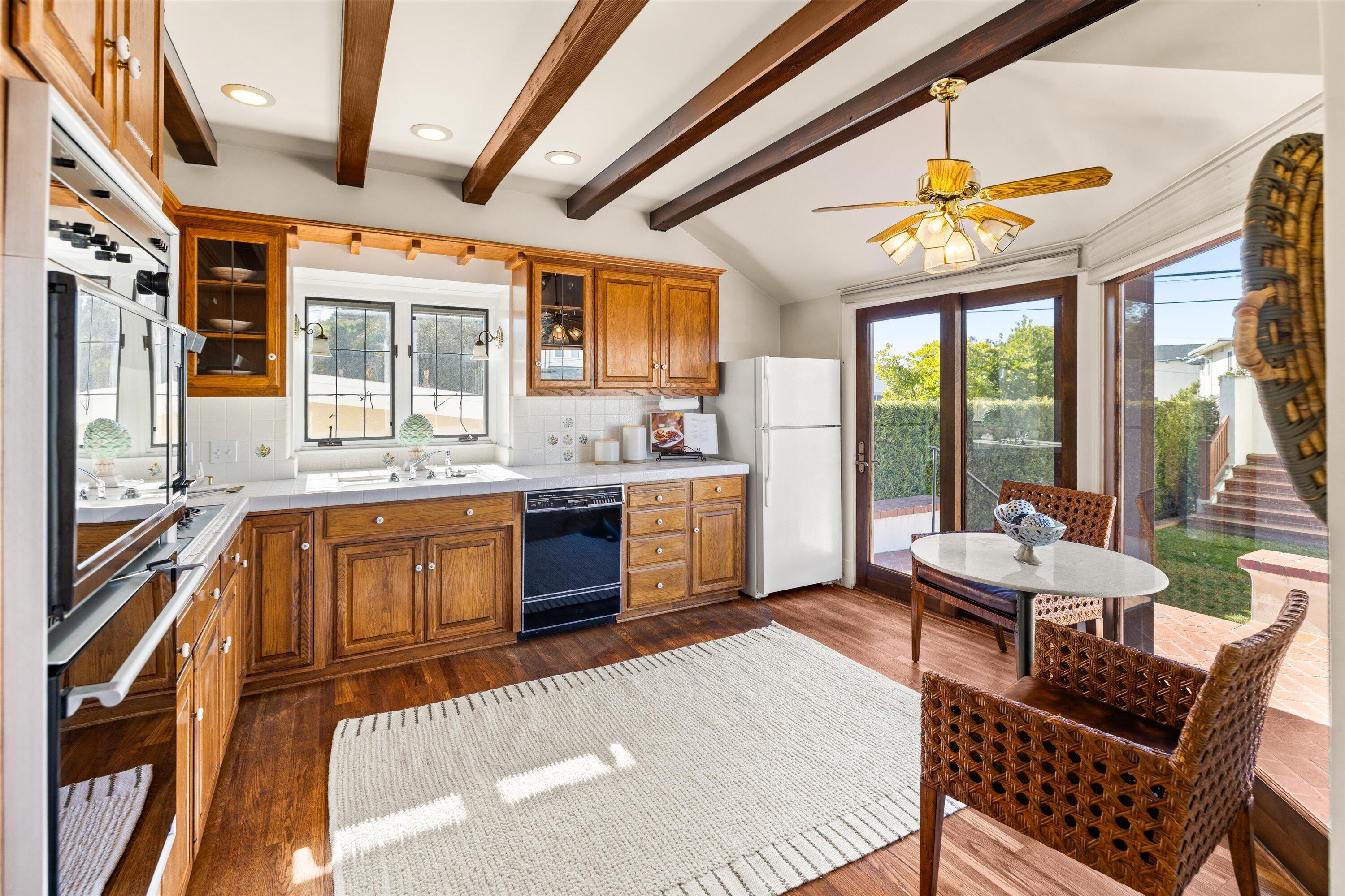 4849 3rd Street Carpinteria, CA 93013 - Photo 20 of 48 a kitchen with a stove a sink and a refrigerator