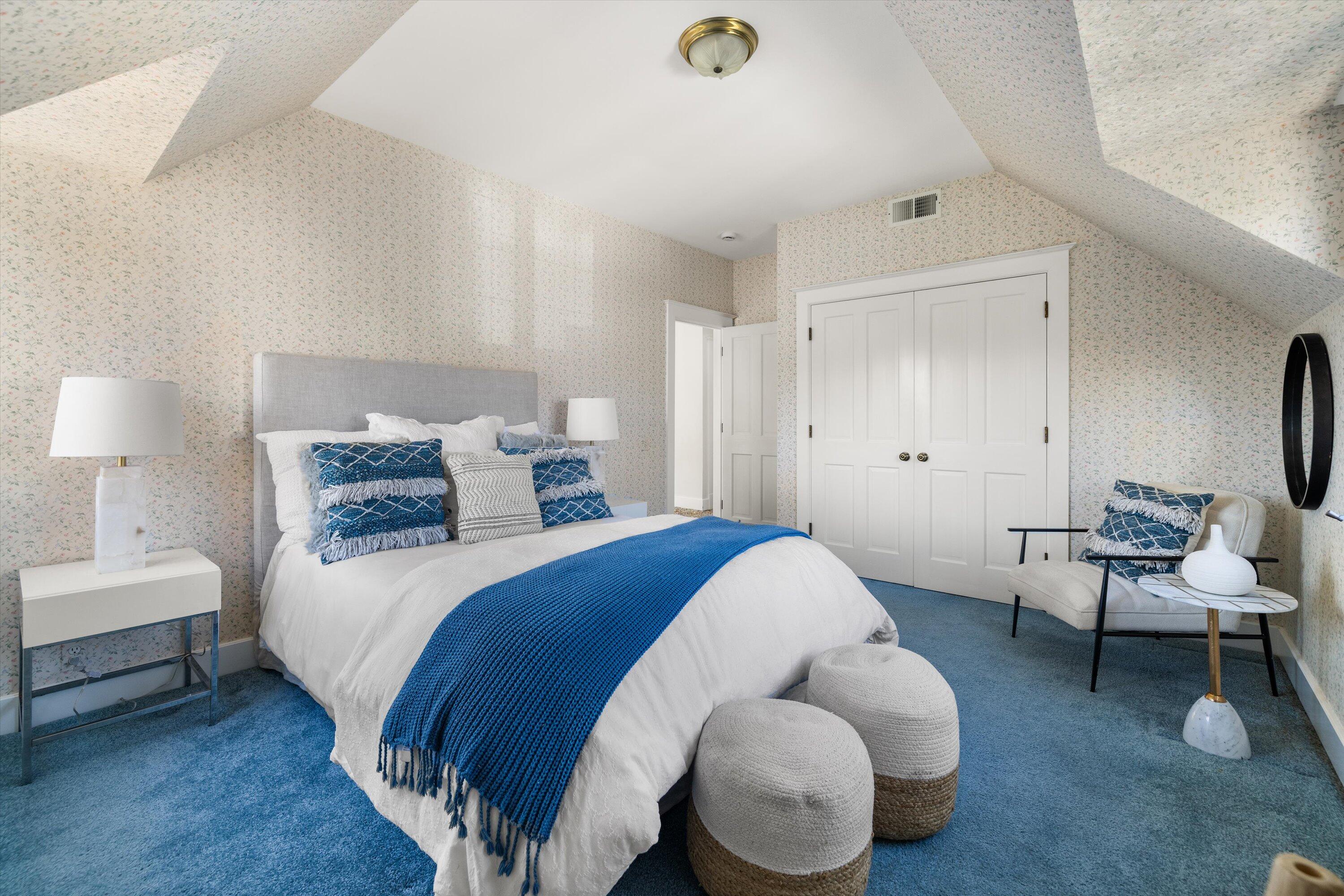 4849 3rd Street Carpinteria, CA 93013 - Photo 22 of 48 a spacious bedroom with a bed and chair