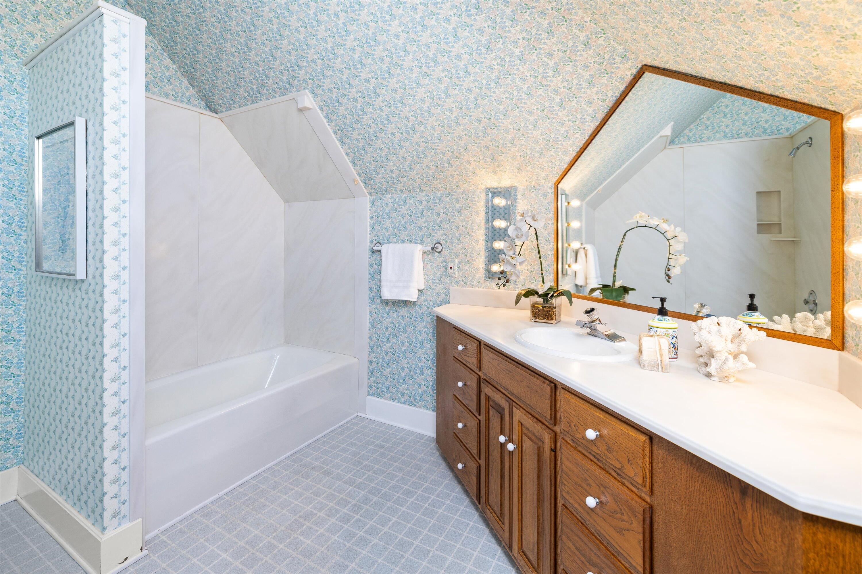 4849 3rd Street Carpinteria, CA 93013 - Photo 25 of 48 a bathroom with a double vanity sink mirror and bathtub