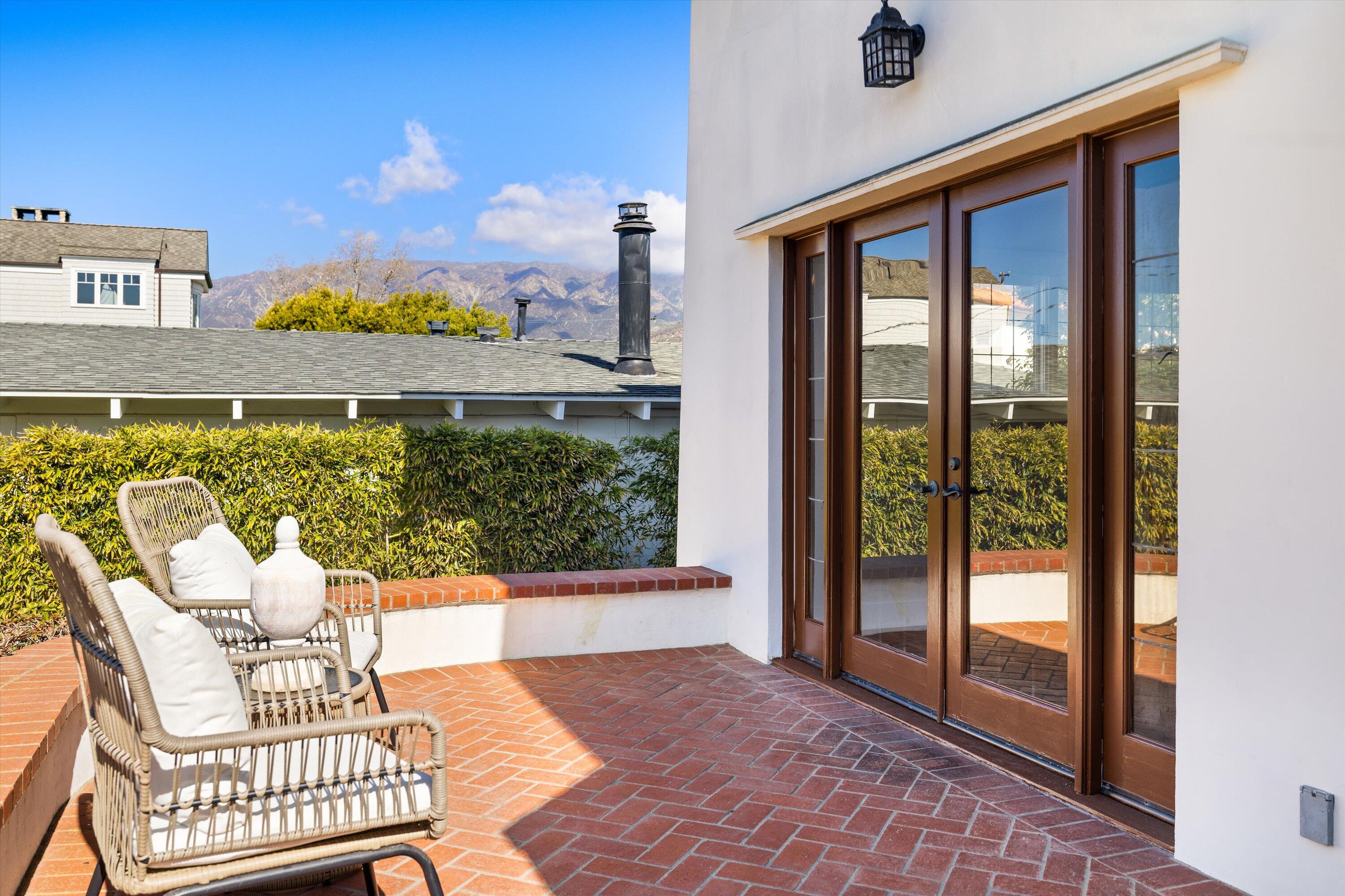 4849 3rd Street Carpinteria, CA 93013 - Photo 27 of 48 a view of a balcony with chair and a floor to ceiling window