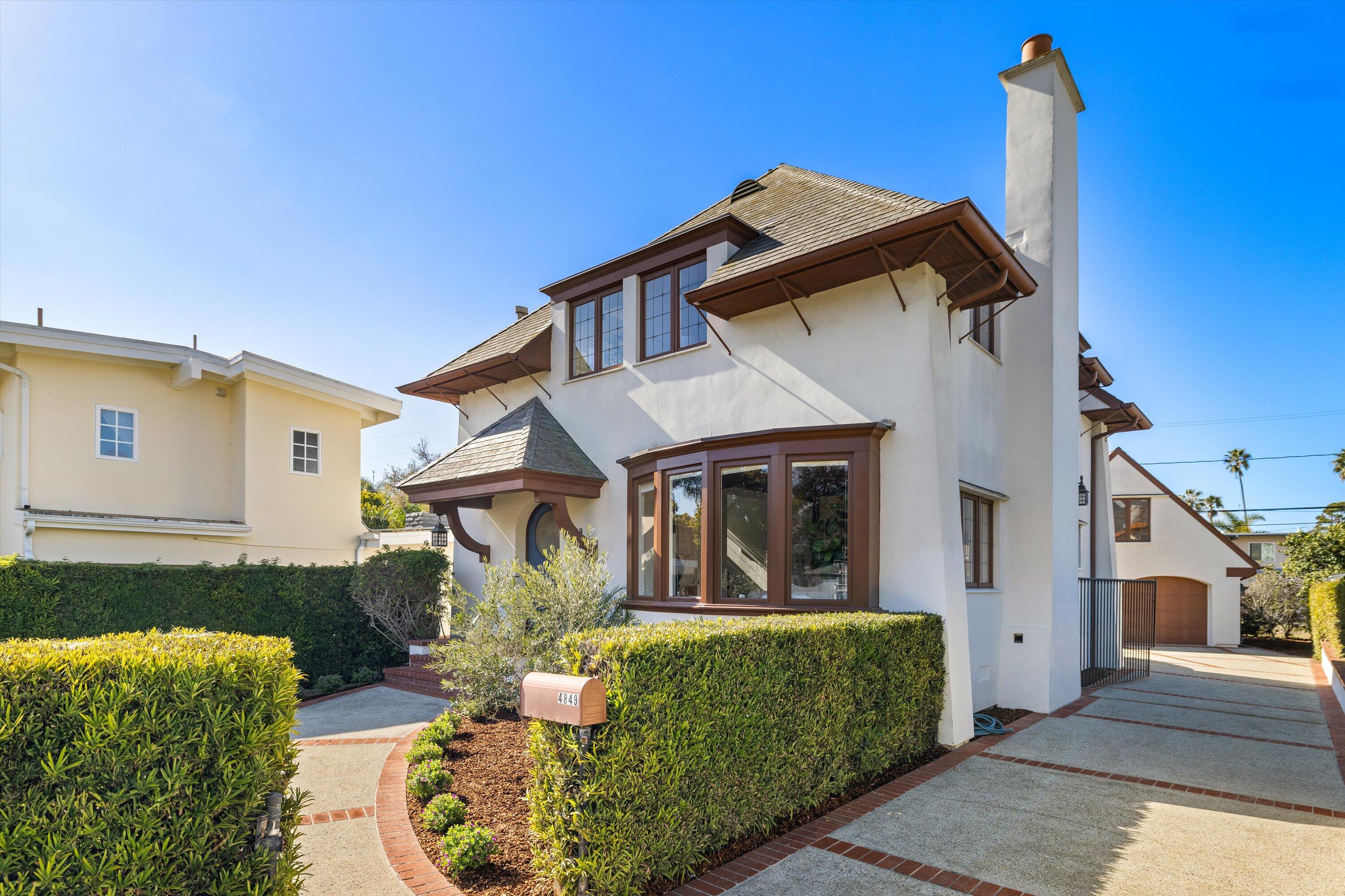 4849 3rd Street Carpinteria, CA 93013 - Photo 6 of 48 a front view of a house with a yard