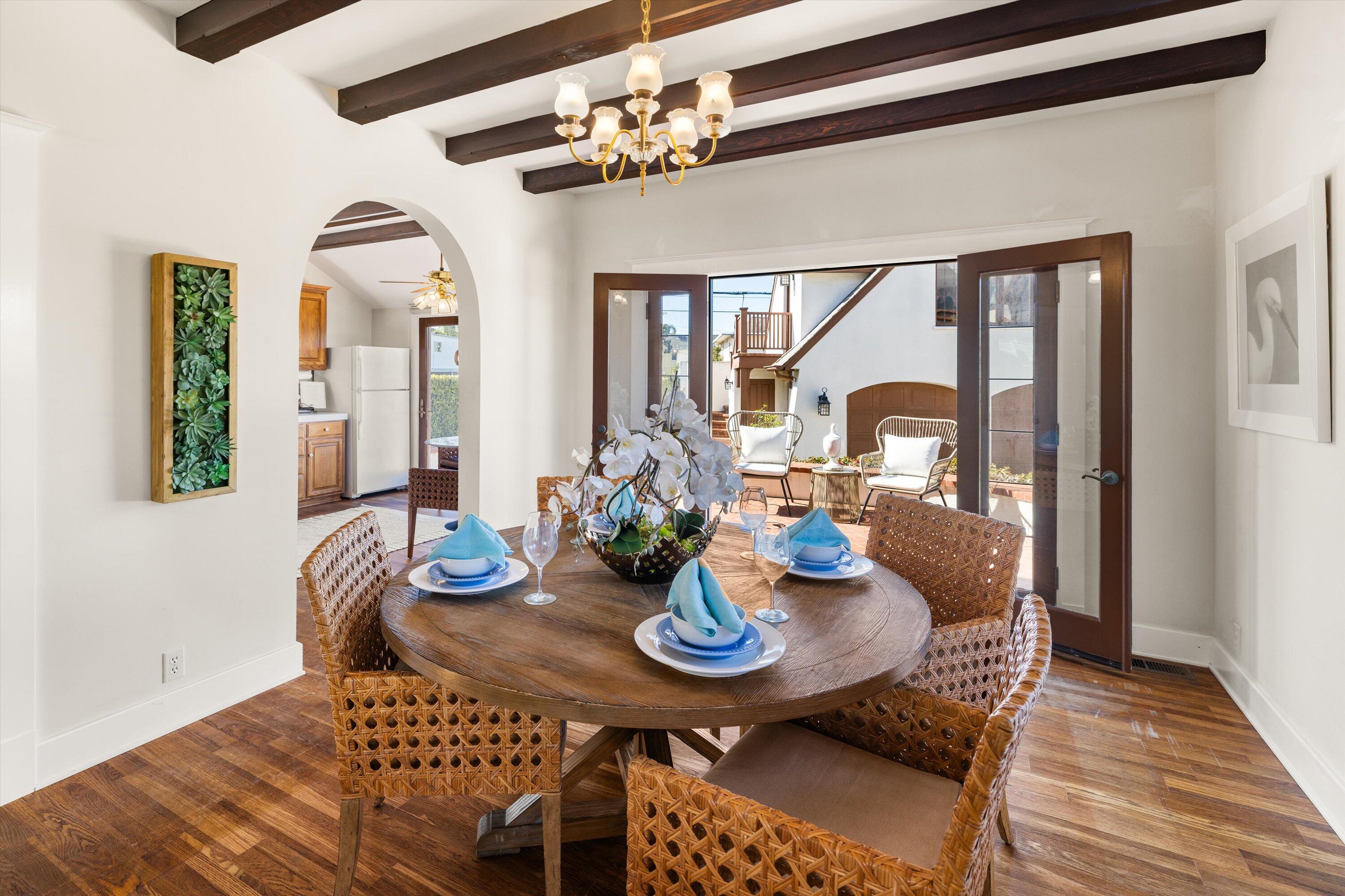 4849 3rd Street Carpinteria, CA 93013 - Photo 10 of 48 a view of a dining room with furniture and wooden floor