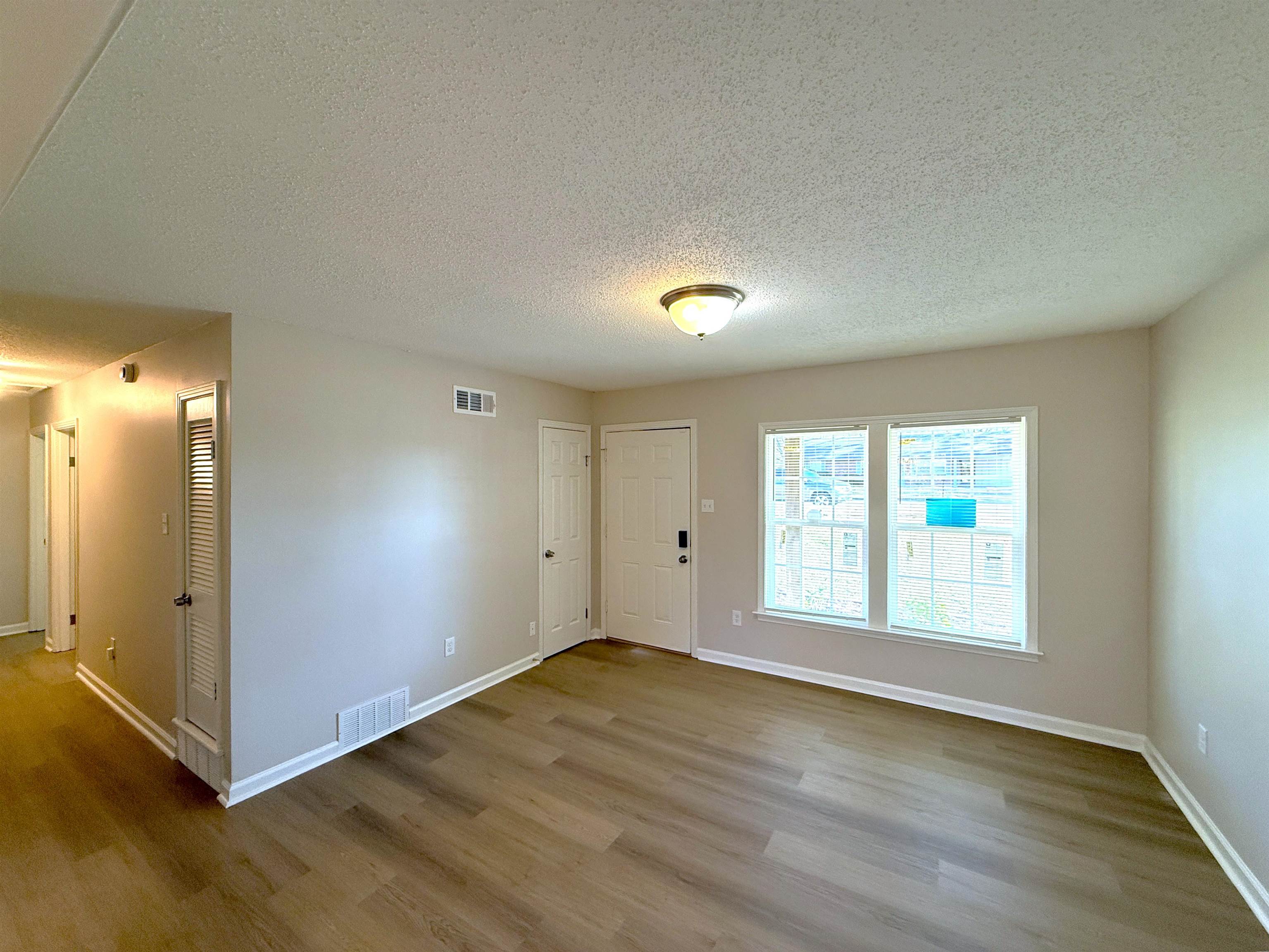 5165 Sea Shore Road Memphis, TN 38109 - Photo 2 of 20 Entrance foyer with a textured ceiling and wood finished floors