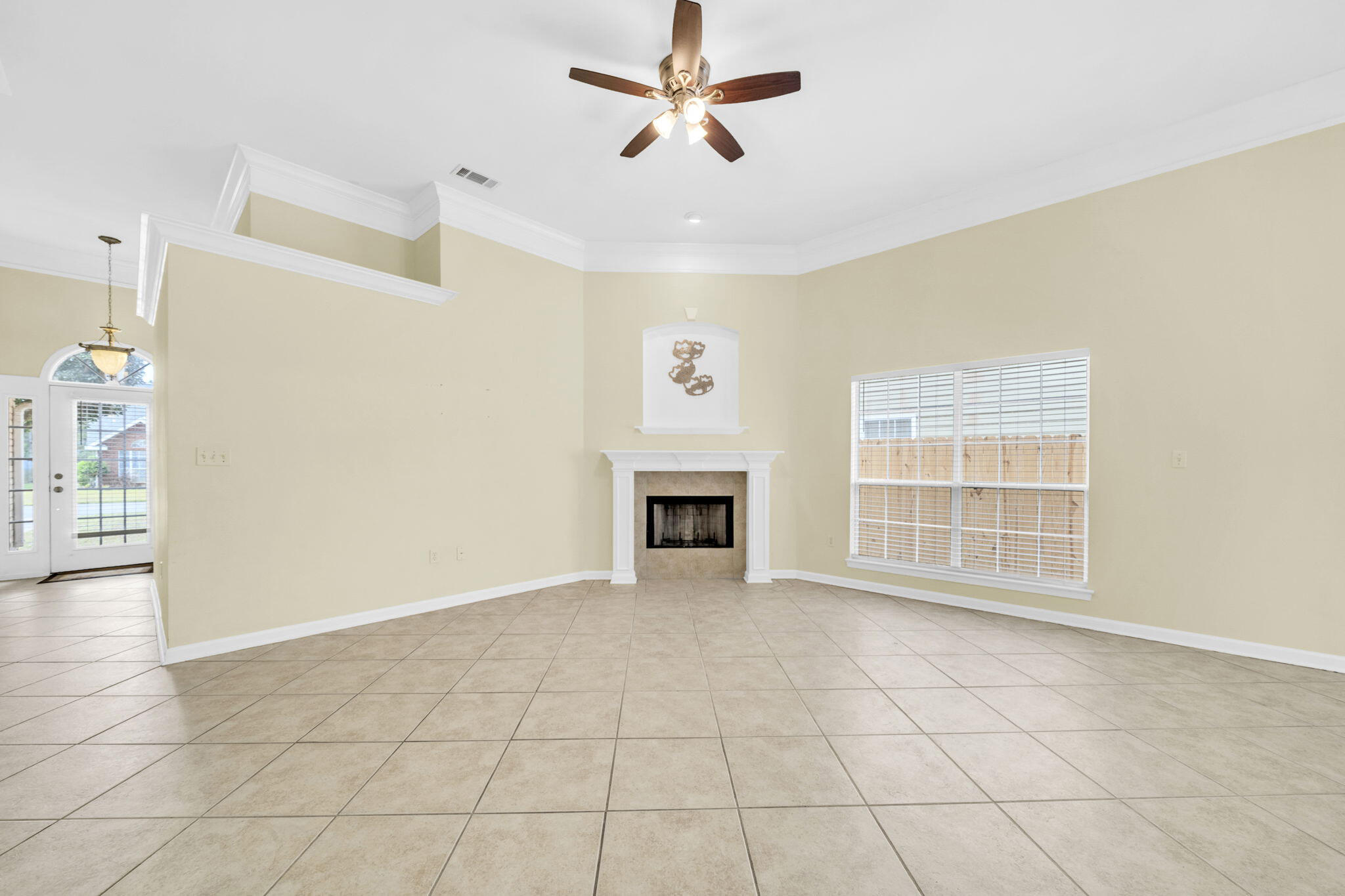 59 Hidden Lakes Drive Destin, FL 32550 - Photo 18 of 39 a view of an empty room with a fireplace and a window