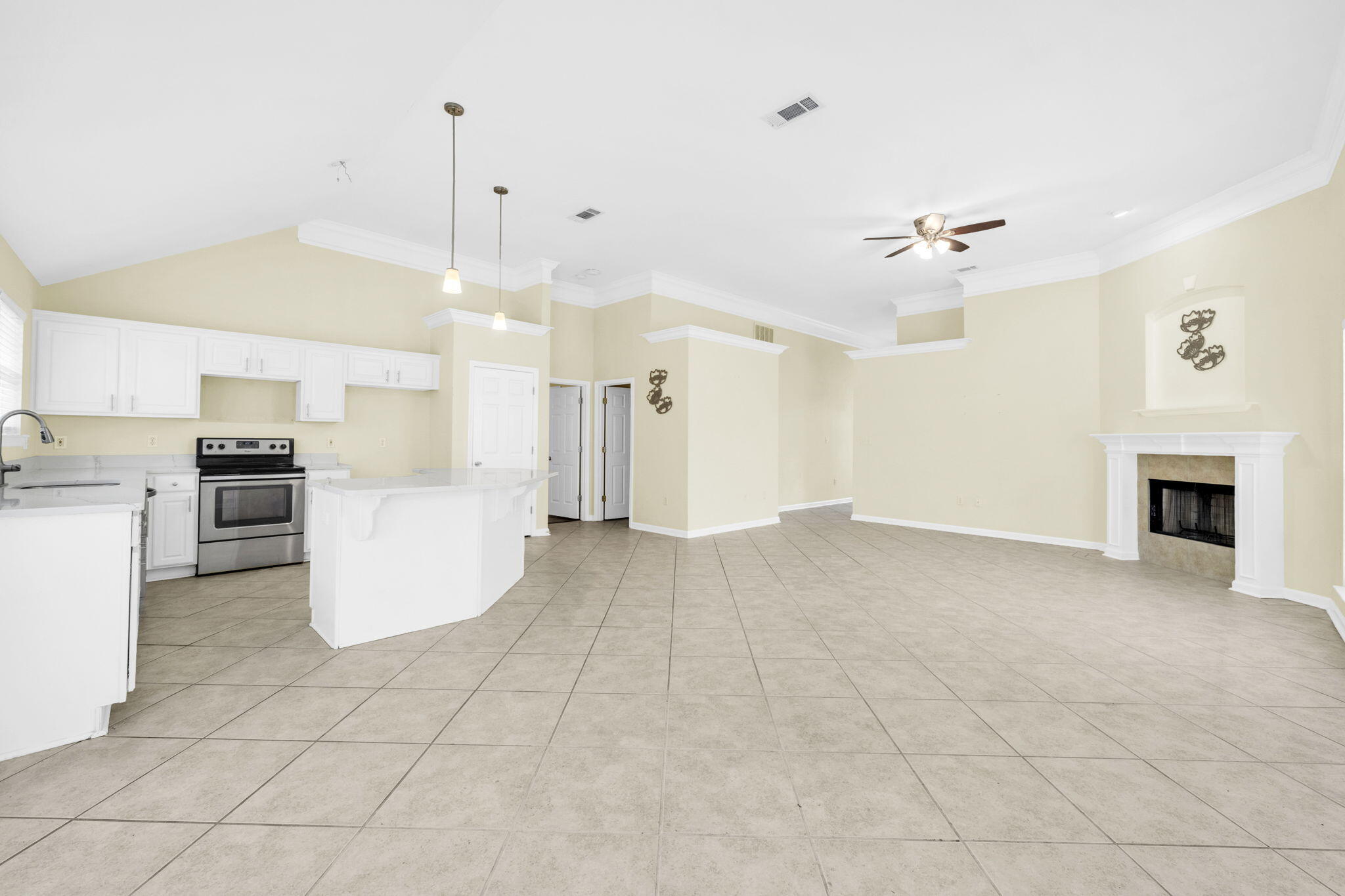 59 Hidden Lakes Drive Destin, FL 32550 - Photo 25 of 39 a view of a kitchen with furniture and a fireplace