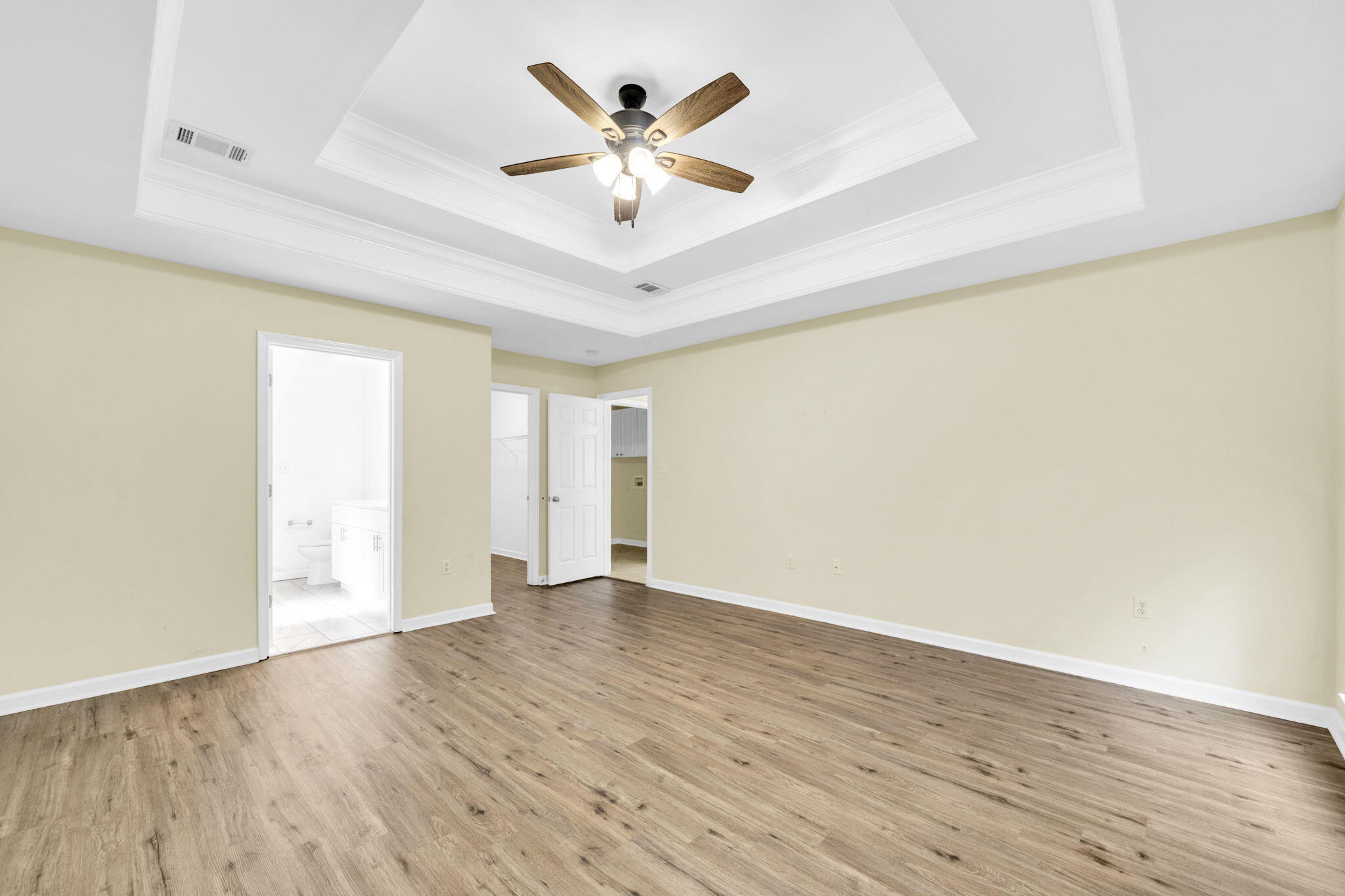 59 Hidden Lakes Drive Destin, FL 32550 - Photo 28 of 39 an empty room with wooden floor and ceiling fan