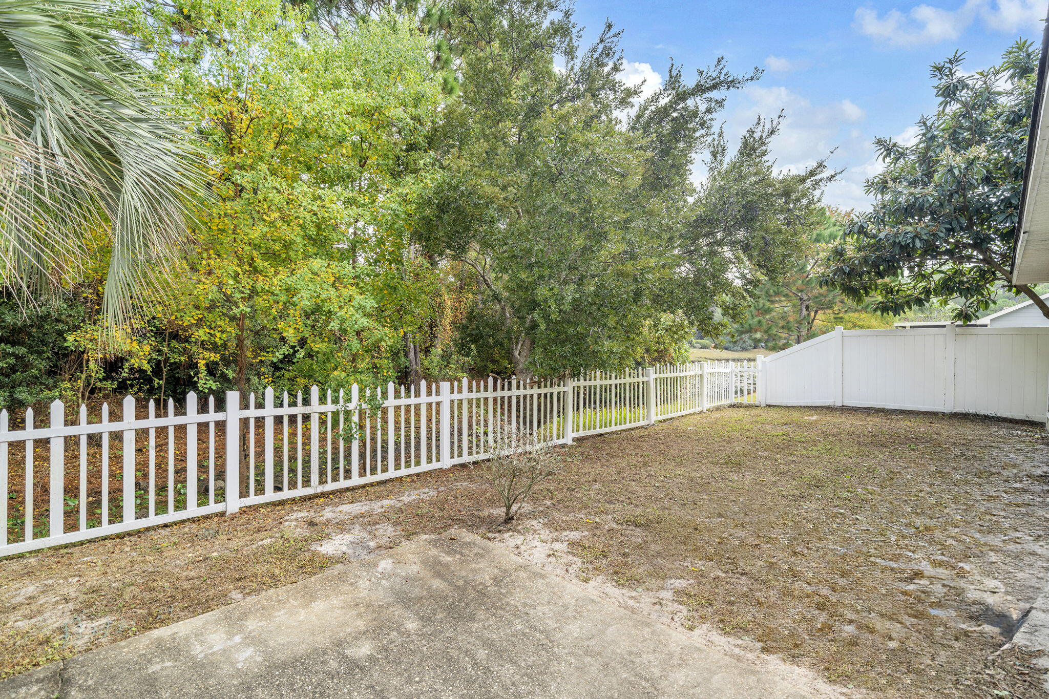 59 Hidden Lakes Drive Destin, FL 32550 - Photo 35 of 39 a view of backyard and trees