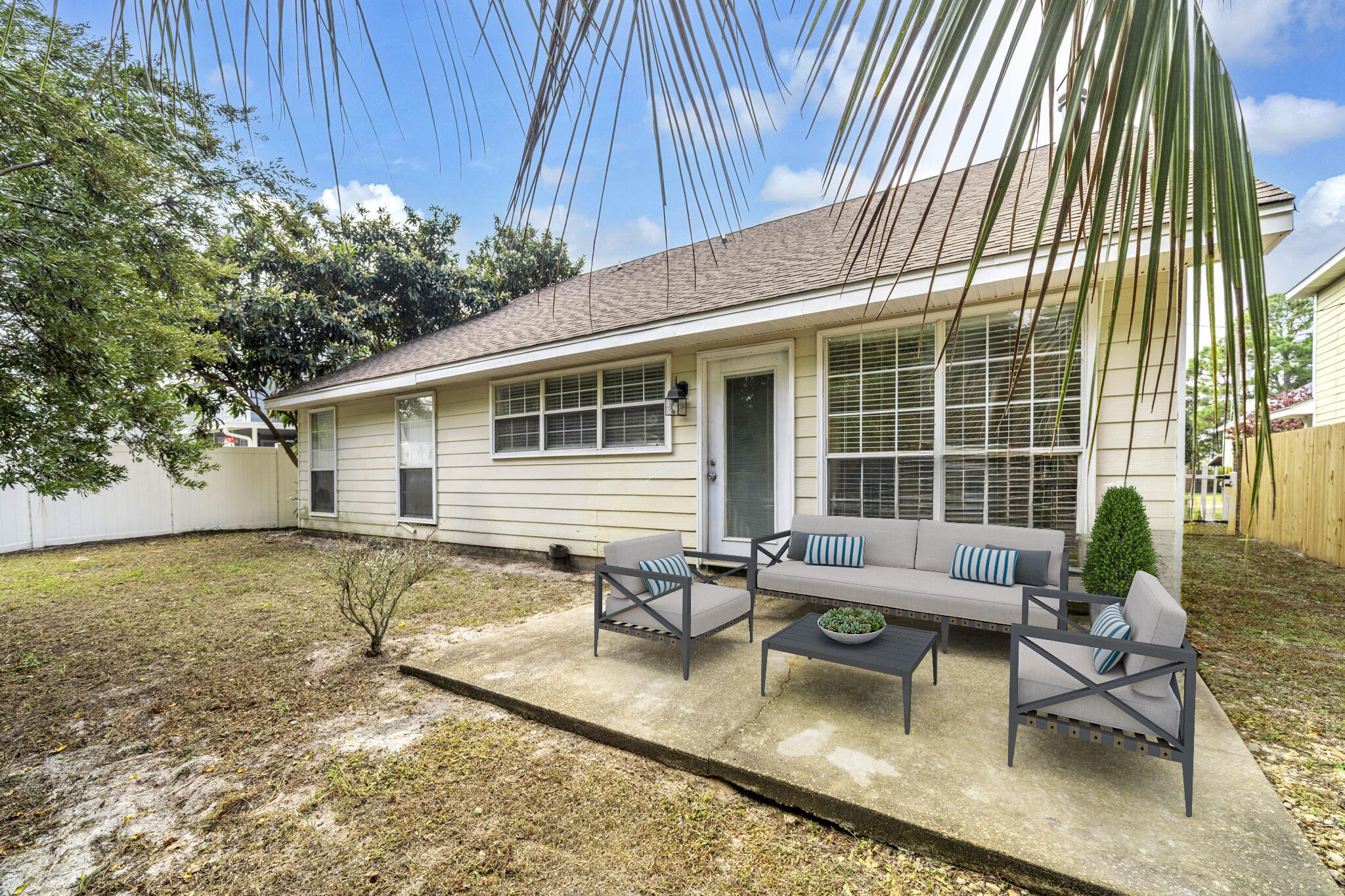 59 Hidden Lakes Drive Destin, FL 32550 - Photo 36 of 39 a view of a house with backyard and sitting area