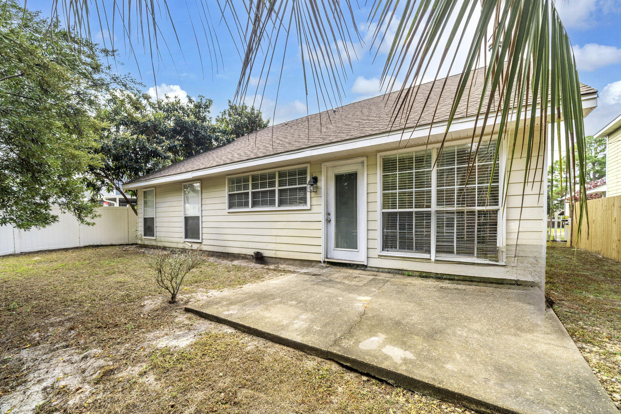 59 Hidden Lakes Drive Destin, FL 32550 - Photo 37 of 39 a view of a house with a yard and wooden fence