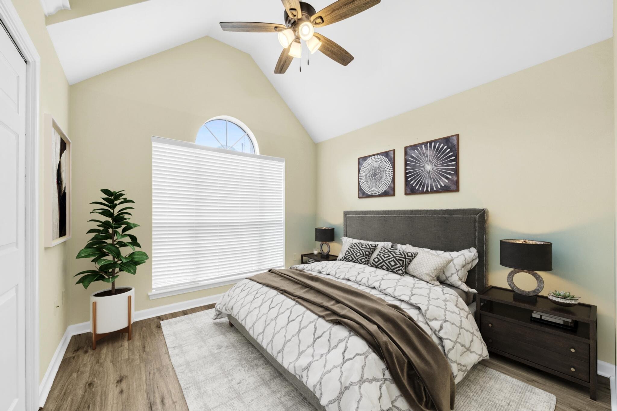 59 Hidden Lakes Drive Destin, FL 32550 - Photo 10 of 39 a bedroom with a bed and a potted plant