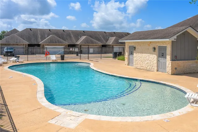 a view of a swimming pool with an outdoor space