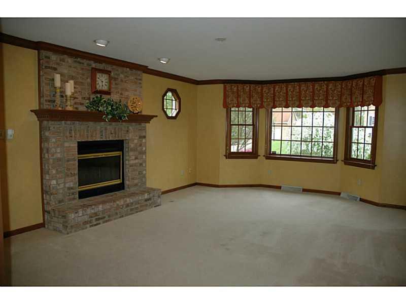 140 Weybridge Road Gibsonia, PA 15044 - Photo 4 of 21 Family Room. Impressive gas fireplace surrounded by beautiful brickwork.