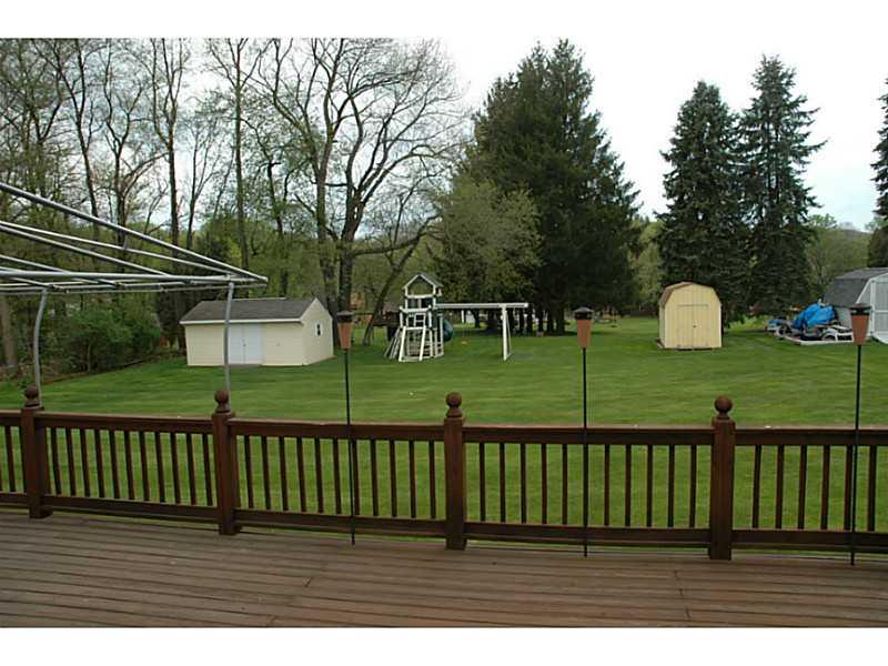 140 Weybridge Road Gibsonia, PA 15044 - Photo 8 of 21 Exterior Back. Table-top backyard. Includes two sheds, one has been converted to a playhouse.