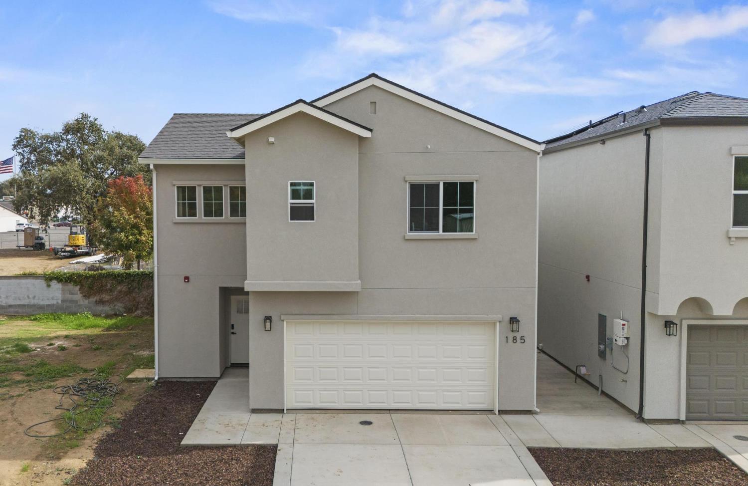 185 Park Circle Gridley, CA 95948 - Photo 1 of 18 a front view of a house with a yard