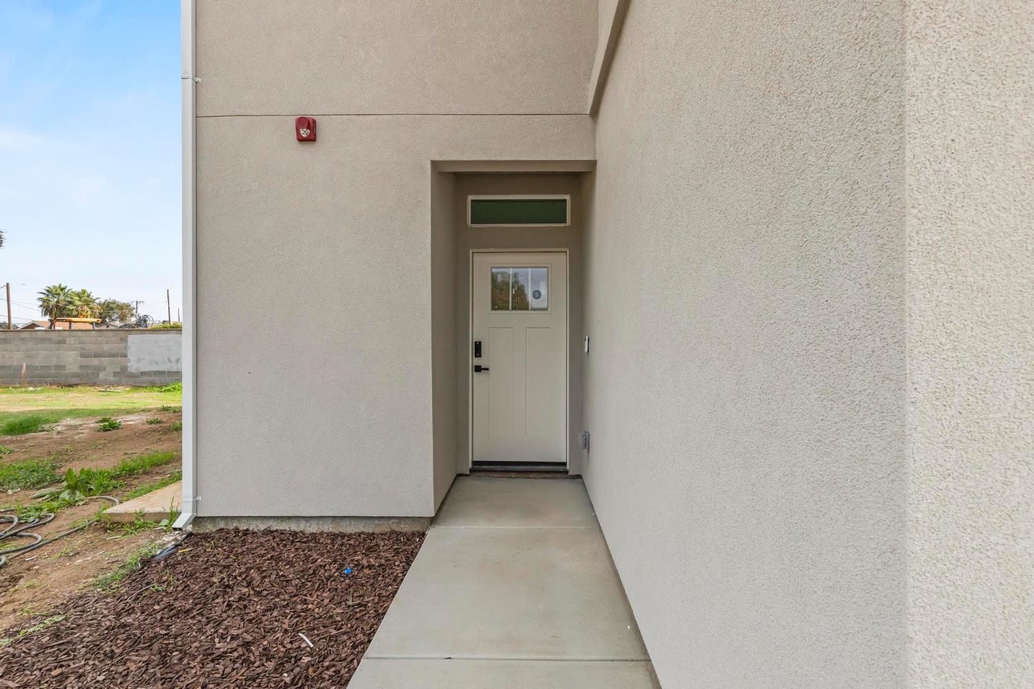 185 Park Circle Gridley, CA 95948 - Photo 3 of 18 a view of a hallway with wooden walls