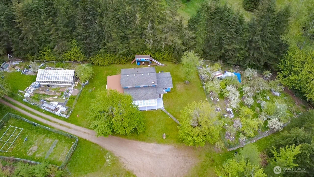 89 Slab Camp Road Sequim, WA 98382 - Photo 37 of 40 an aerial view of a house with a yard basket ball court