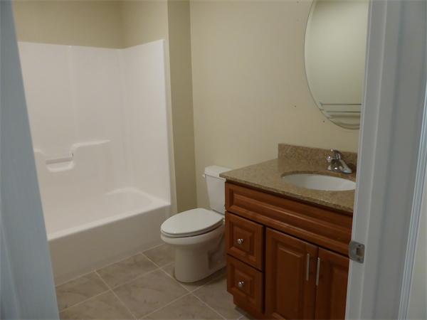 280 Hathaway Road Acushnet, MA 02743 - Photo 11 of 26 a bathroom with a sink a toilet and shower
