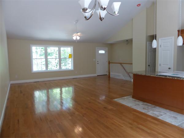 280 Hathaway Road Acushnet, MA 02743 - Photo 5 of 26 a view of an empty room with wooden floor and a window