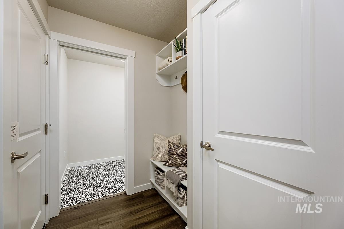 7080 South Gamely Avenue Meridian, ID 83642 - Photo 16 of 30 Mudroom with a textured ceiling and dark wood-style flooring