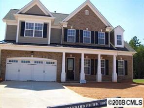 1428 Secret Path Drive, Unit 212 Fort Mill, SC 29708 - Photo 1 of 7 a view of a white house with large windows