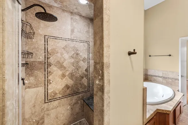 a bathroom with a bathtub and a sink