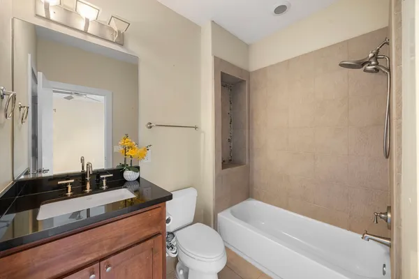a kitchen with stainless steel appliances granite countertop a refrigerator and a stove