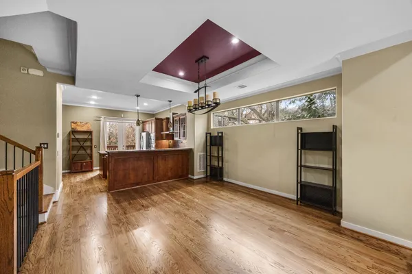 a kitchen with stainless steel appliances granite countertop a sink and a refrigerator