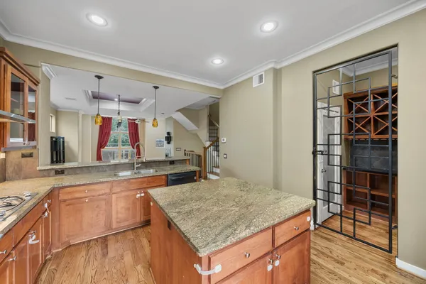 a kitchen with granite countertop a refrigerator and a stove