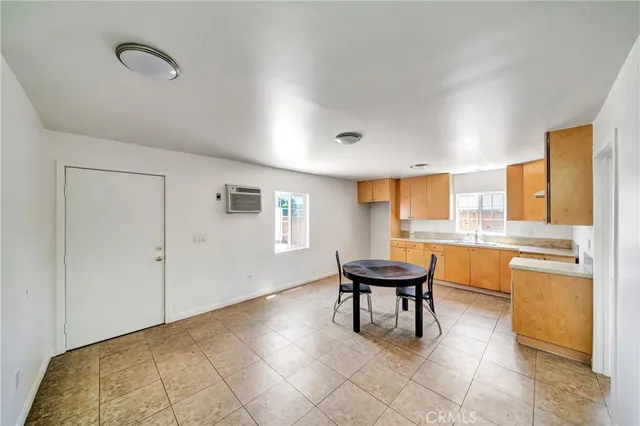 a room with a table and chairs in it