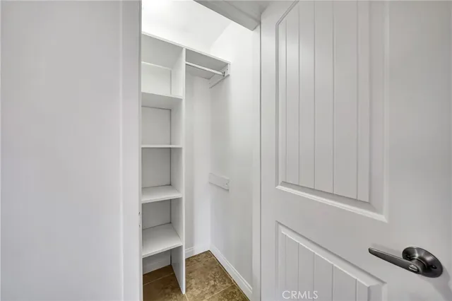 a view of an empty walk in closet