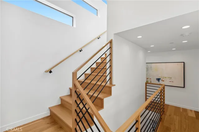 a large bedroom with a large bed and a large window