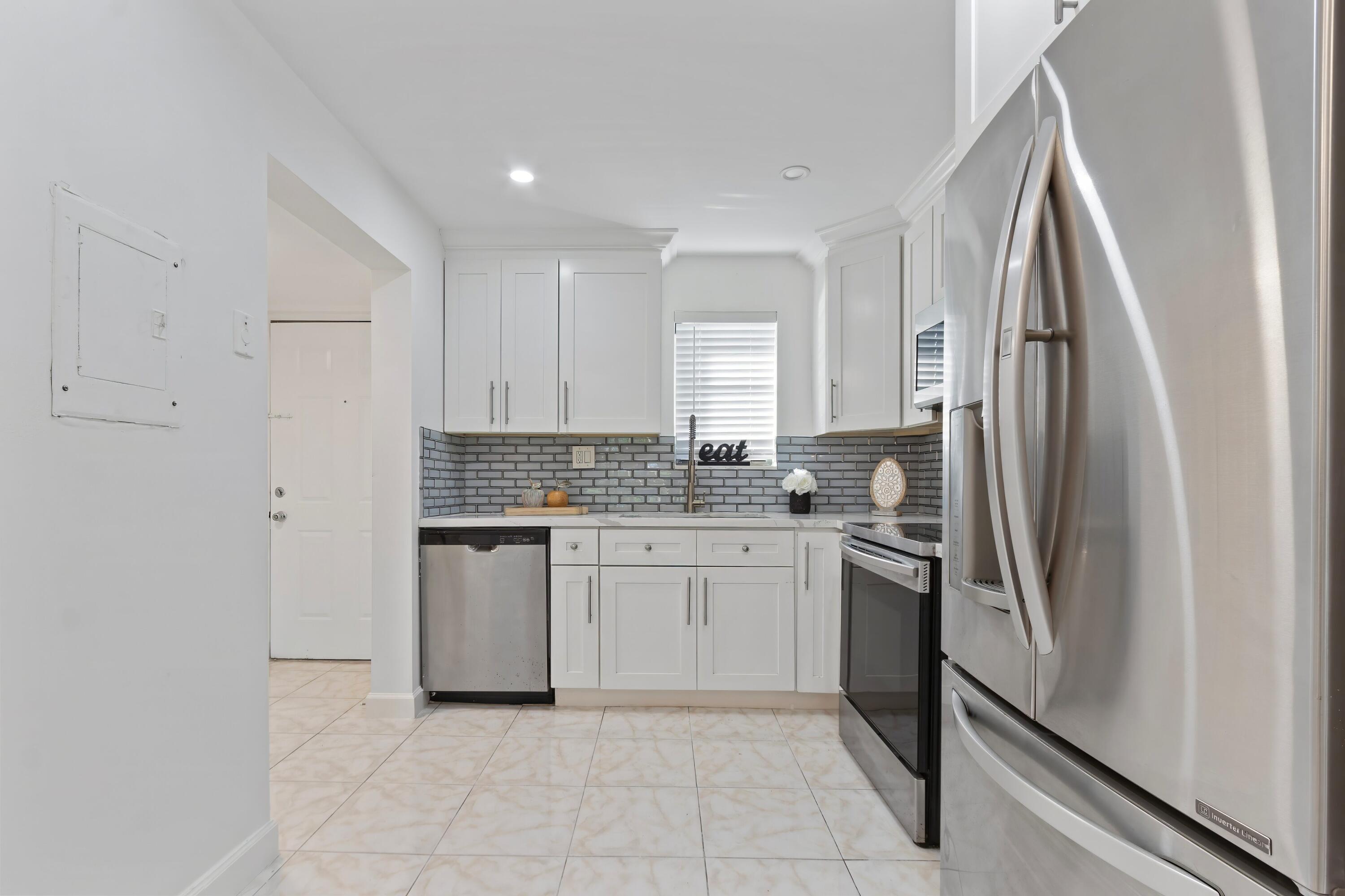 9370 Southwest 8th Street, Unit 208 Boca Raton, FL 33428 - Photo 3 of 24 Open to Dinning Room