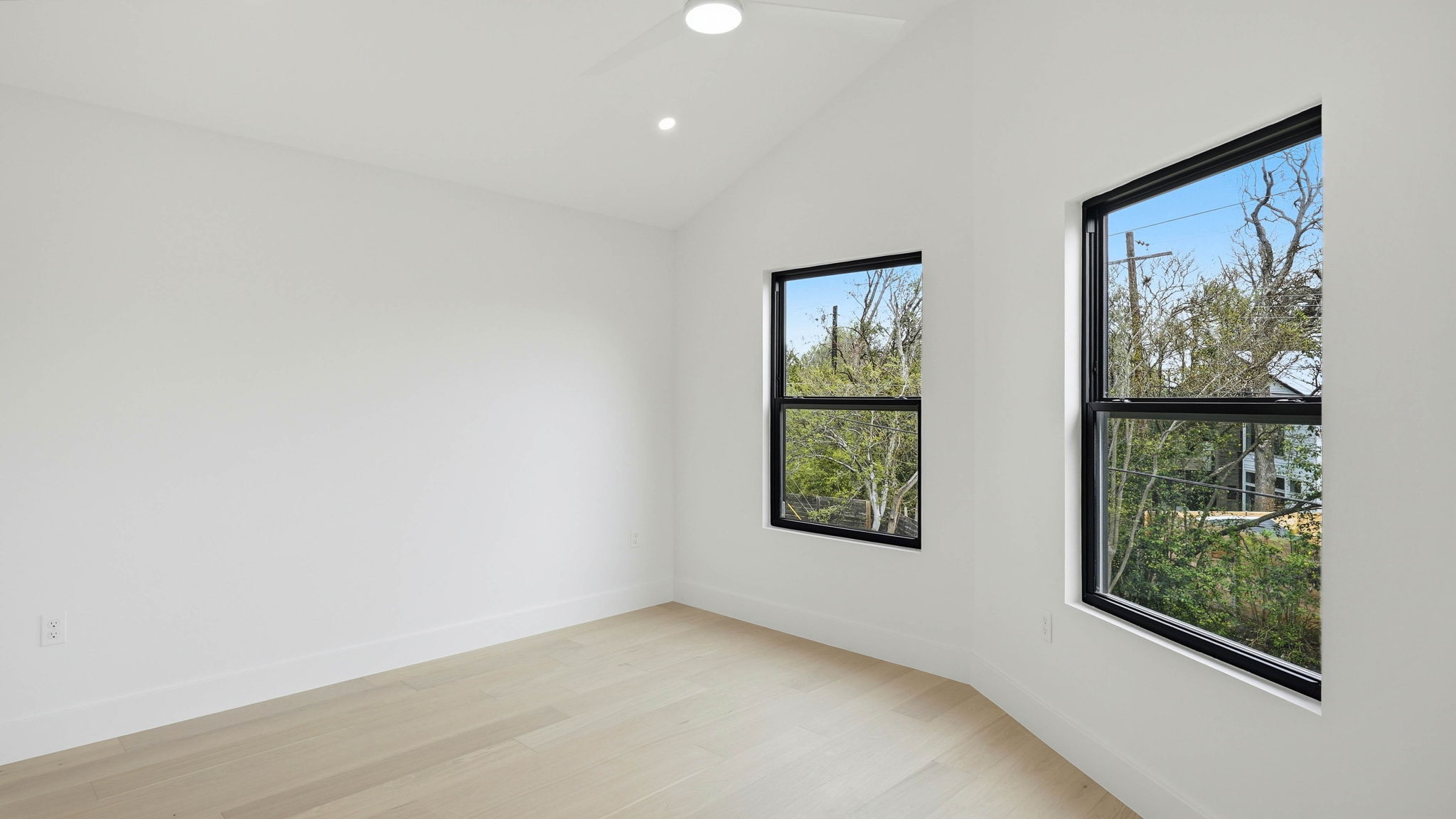 300 Lightsey Road, Unit 2 Austin, TX 78704 - Photo 18 of 28 Spare room with light wood-style floors, recessed lighting, and lofted ceiling