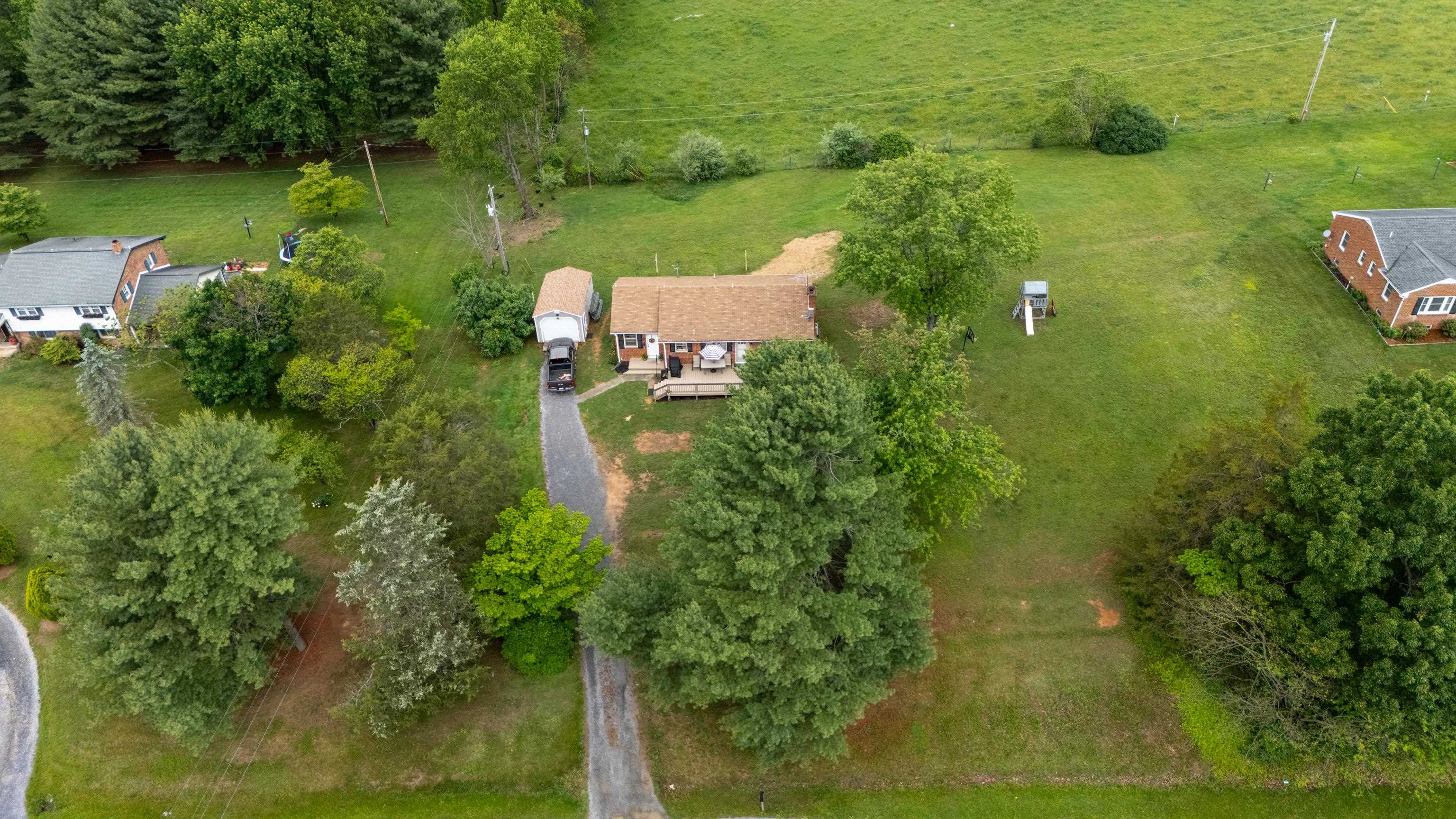7827 Lee Highway Raphine, VA 24472 - Photo 50 of 62 an aerial view of residential houses with outdoor space and trees