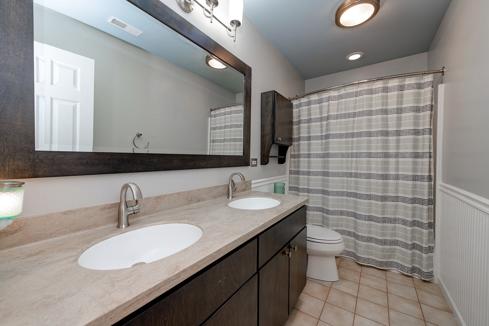 866 Deer Path Drive Antioch, IL 60002 - Photo 14 of 28 a bathroom with a double vanity sink toilet and mirror