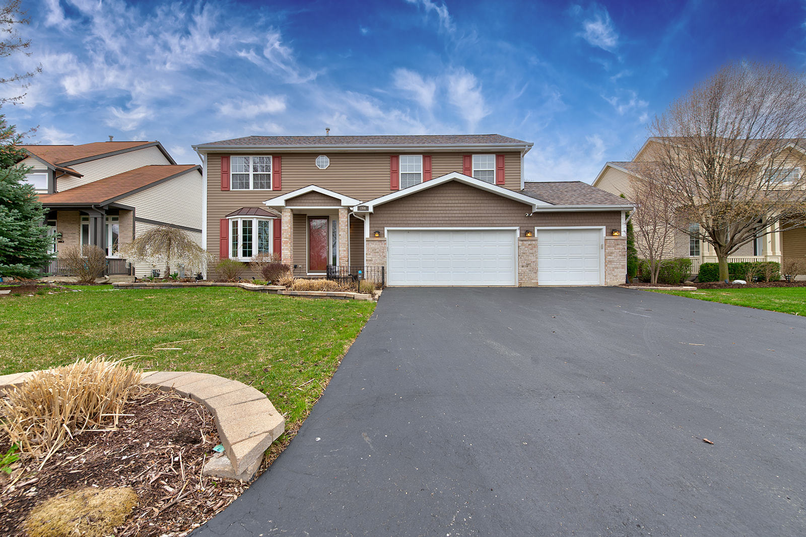 866 Deer Path Drive Antioch, IL 60002 - Photo 2 of 28 a front view of a house with a yard and garage