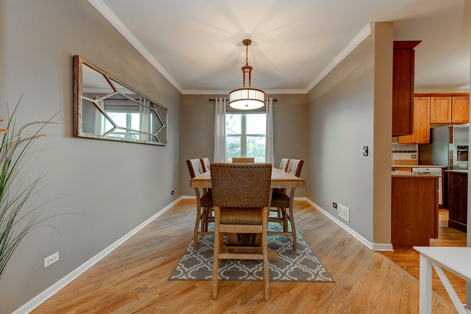 866 Deer Path Drive Antioch, IL 60002 - Photo 5 of 28 a dining room with furniture a chandelier and wooden floor