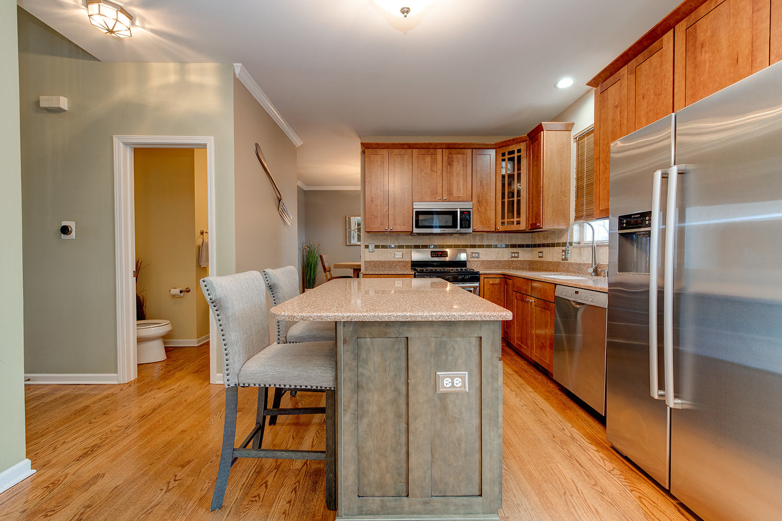 866 Deer Path Drive Antioch, IL 60002 - Photo 7 of 28 a kitchen with stainless steel appliances granite countertop a sink a stove and a refrigerator