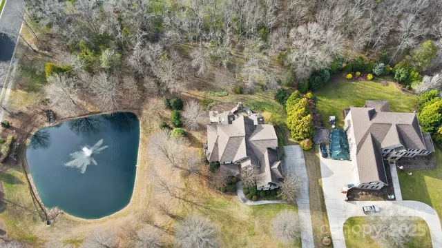 an aerial view of a house with outdoor space