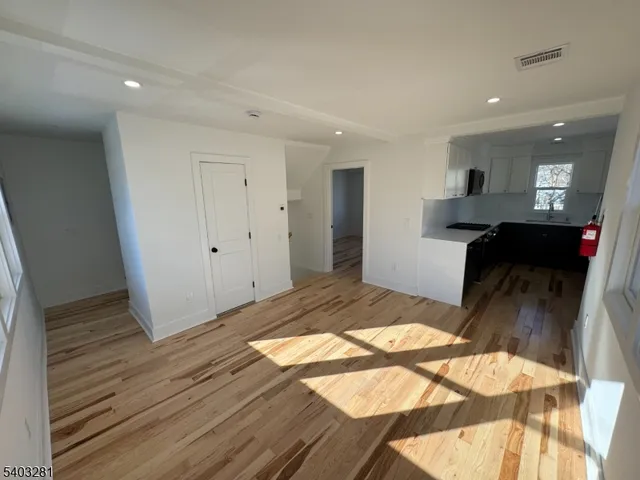 a bedroom with a bed and a mirror