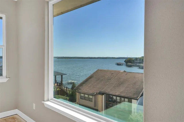 a view of a terrace with a table and chairs