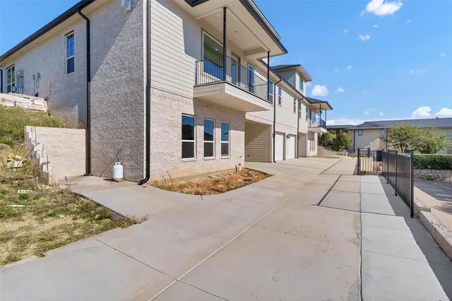 an aerial view of a house with outdoor space