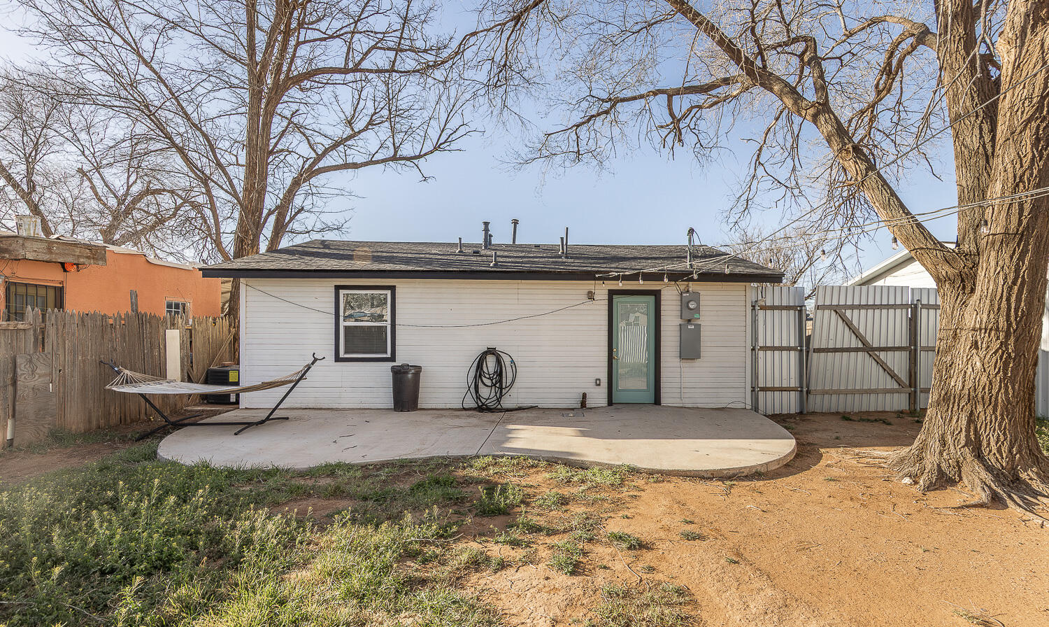4816 40th Street Lubbock, TX 79414 - Photo 17 of 21 a view of a white house with a large tree