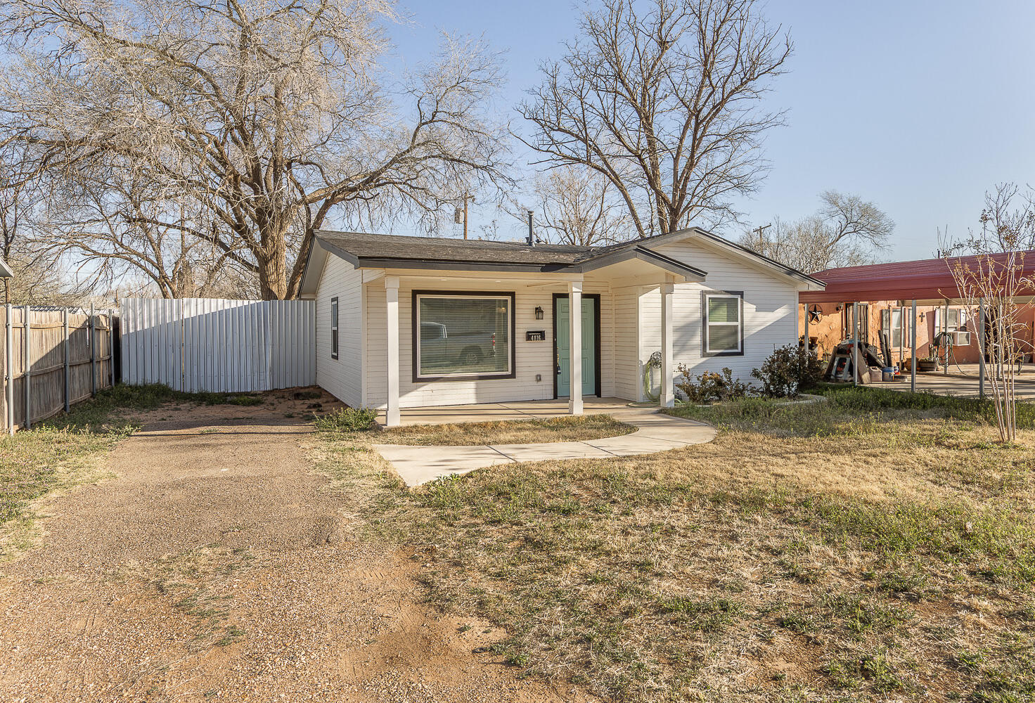 4816 40th Street Lubbock, TX 79414 - Photo 20 of 21 a front view of a house with a yard and garage