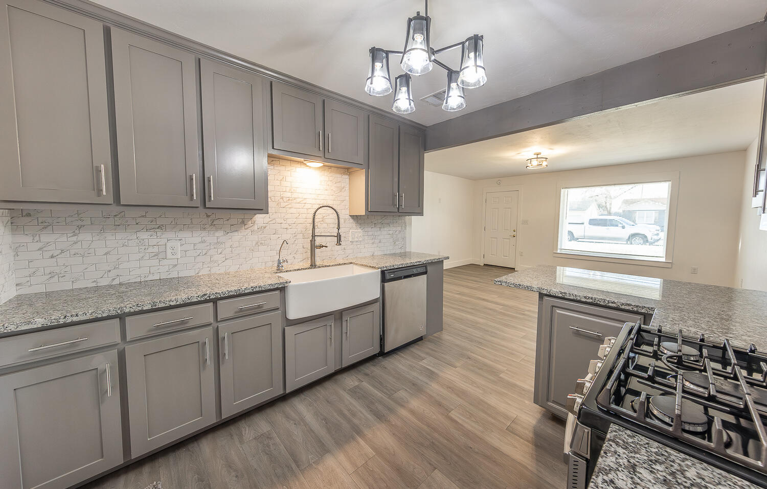 4816 40th Street Lubbock, TX 79414 - Photo 8 of 21 a kitchen with a sink stove and cabinets