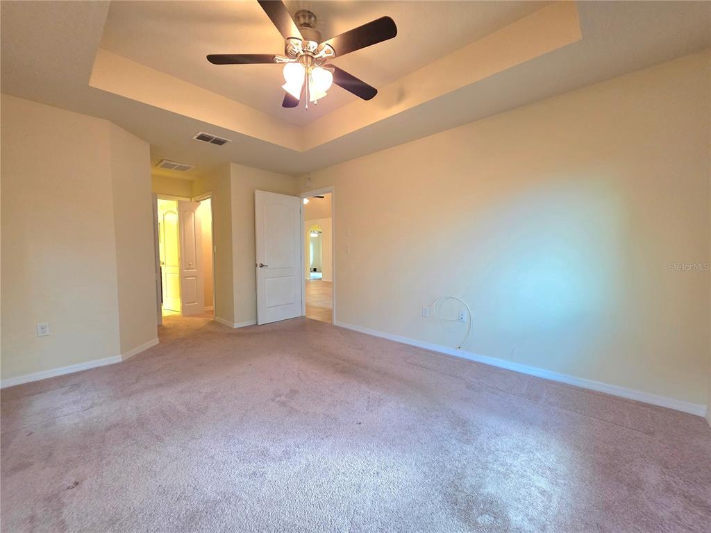4284 High Ridge Avenue Spring Hill, FL 34609 - Photo 21 of 40 an empty room with windows and fan