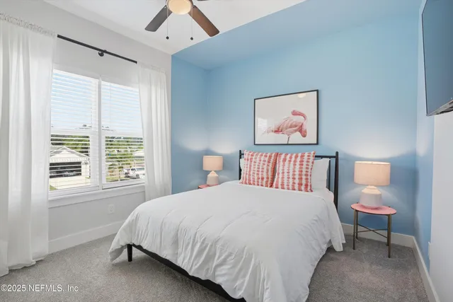 a bedroom with bed and window