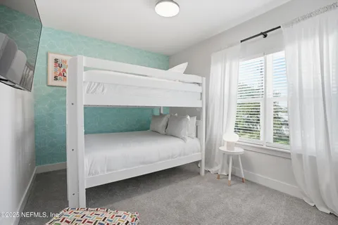 a bathroom with a toilet a sink and a mirror