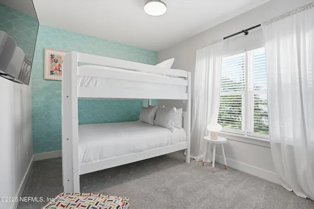 a bathroom with a toilet a sink and a mirror